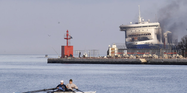 Smoke billows from the Italian-flagged Norman Atlantic ferry after that was towed into the port of Brindisi, southern Italy, Saturday, Jan. 3, 2015. For a second day, fierce heat from a slow-burning blaze kept firefighters and other investigators on Saturday from searching the hold and vehicle decks of a Greek ferry for more bodies. At least 11 people perished in the pre-dawn blaze on Dec. 28 aboard the Norman Atlantic, on a voyage between Greece and Italy. Authorities fear more bodies might be
