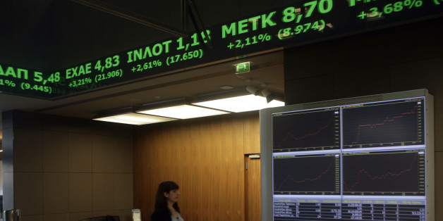 ATHENS, GREECE - JANUARY 12: A woman walks inside the Stock Exchange on January 12, 2015 in Athens, Greece. Global markets have been shaken by fears that Greece could abandon the Euro if the radical left-wing Syriza party wins the election. (Photo by MIlos Bicanski/Getty Images)