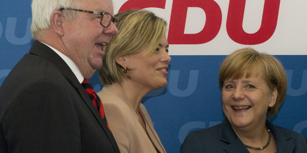 (L-R) Michael Fuchs, member of the CDU parlamentary fraction, Julia Kloeckner, Vice-Chairman of the CDU and German Chancellor Angela Merkel and candidate of the German Christian Democratic Union (CDU) party arrive for their party's executive board meeting at the headquarters at the Konrad-Adenauer-House in Berlin on September 16, 2013 a week ahead of the German general elections. AFP PHOTO / JOHN MACDOUGALL (Photo credit should read JOHN MACDOUGALL/AFP/Getty Images)
