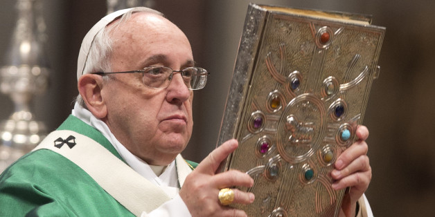 Pope Francis holds the Gospels book as he celebrates a Mass for newly-elected cardinals, in St. Peter's Basilica at the Vatican, Sunday, Feb. 15, 2015. Pope Francis welcomed 20 new cardinals Saturday into the elite club of churchmen who will elect his successor and immediately delivered a tough-love message to them, telling them to put aside their pride, jealousy and self-interests and instead exercise perfect charity. (AP Photo/Andrew Medichini)