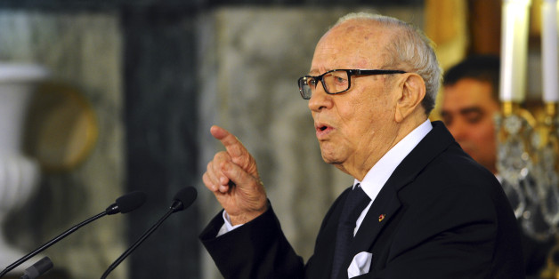 Tunisian President Beji Caid Essebsi delivers his speech during a cabinet takeover ceremony in Tunis, Friday, Feb. 6, 2015. Prime Minister Essid, whose cabinet has ministers from four parties including the powerful Islamist group, promised "work and nothing but work" on the country's economic and security problems. (AP Photo/Hassene Dridi)