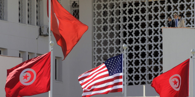 Tunisian and a United States flags flying at the Tunisian Foreign Ministry, for the visit of the US Secretary of State Hillary Clinton, n Tunis, Tunisia, Thursday , March 17, 2011. (AP Photo/Lefteris Pitarakis)