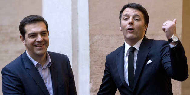 Italian Premier Matteo Renzi, right, and Greek Prime Minister Alexis Tsipras shake hands for photographers before a meeting at Rome's Palazzo Chigi government office, Tuesday, Feb. 3, 2015. Tsipras and Greek Finance Minister, Yanis Varoufakis, were in Rome Tuesday for talks with government officials. (AP Photo/Andrew Medichini)