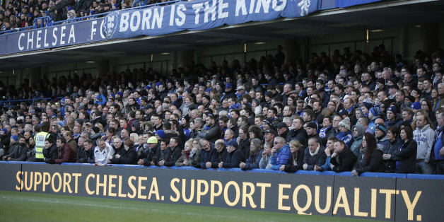 Chelsea fans watch an English Premier League soccer match against Burnley at the Stamford Bridge ground in London, Saturday, Feb. 21, 2015. British police launched an investigation into further suspected racism involving Chelsea fans as the London club used Saturdayâs Premier League game to celebrate diversity in football. Stickers emblazoned with âSupport Chelsea Support Equalityâ were handed out at Stamford Bridge after a week when public acts of racism by some Chelsea fans brou