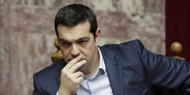 Greece's Prime Minister Alexis Tsipras gestures during a Presidential vote in Athens, on Wednesday, Feb. 18, 2015. Greece's parliament elected a conservative law professor and veteran politician Wednesday as the country's new president, after he received support from the new left-wing government and main center-right opposition party. (AP Photo/Petros Giannakouris)