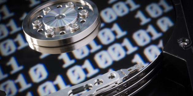 BERLIN, GERMANY - JANUARY 29: Symbolic photo for data protection, reflection of a binary code in a computer hard drive on January 29, 2015 in Berlin, Germany. (Photo by Thomas Trutschel/Photothek via Getty Images)
