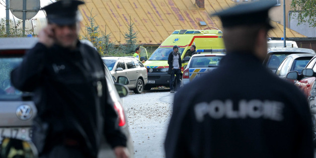 ZDAR NAD SAZAVOU, CZECH REPUBLIC - OCTOBER 14: Police officers stand in front of a Czech high school after a woman stabbed students with a knife on October 14, 2014 in Zdar nad Sazavou, 160 km (100 miles) southeast of Prague, Czech Republic. A 26-year-old woman killed a 16-year old boy and injured a police officer and two other 17-year old female students during the knife attack at the school. (Photo by Libor Plihal/isifa/Getty Images)