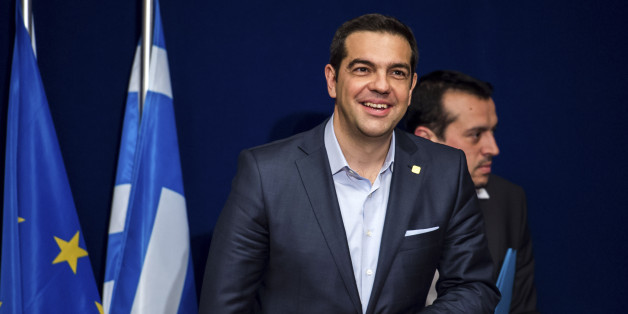 Greek Prime Minister Alexis Tsipras takes his seat during a media conference after an EU summit in Brussels on Thursday, Feb. 12, 2015. European Union leaders on Thursday said the full respect of the planned weekend cease-fire in eastern Ukraine will be essential before there could be a change in the sanctions regime imposed on Moscow. (AP Photo/Geert Vanden Wijngaert)
