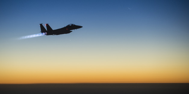 In this Tuesday, Sept. 23, 2014 photo, released by the U.S. Air Force, a U.S. F-15E Strike Eagle flies over northern Iraq, after conducting airstrikes in Syria. U.S.-led coalition warplanes bombed oil installations and other facilities in territory controlled by Islamic State militants in eastern Syria on Friday, Sept. 26, 2014, taking aim for a second consecutive day at a key source of financing that has swelled the extremist group's coffers, activists said. (AP Photo/U.S. Air Force, Matthew Br