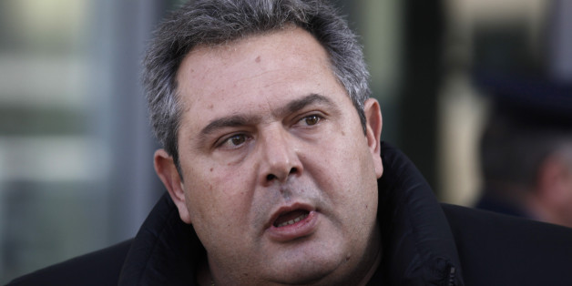 FILE - In this photo taken on Sunday, Dec. 21 2014 leader of the Independent Greeks Panos Kamenos, speaks to the media during his arrival at the prosecutors' office to testify, in Athens. Panos Kammenos, the Independent Greeks leader, was named defense minister on Tuesday, Jan. 27, 2015. Greece's Syriza party gained the key backing needed to form a government Monday, creating a surprise alliance with the small right-wing party of Kammenos that signals possible confrontation over the country's bailout. (AP Photo/Kostas Tsironis, File)