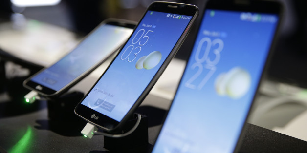 LG's G Flex smartphones are displayed at the International Consumer Electronics Show(CES) on Thursday, Jan. 9, 2014, in Las Vegas. (AP Photo/Jae C. Hong)
