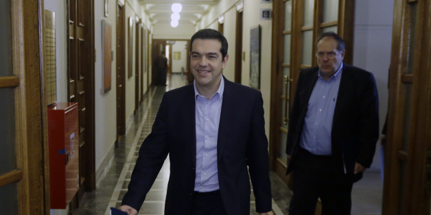 Greece's Prime Minister Alexis Tsipras arrives for an inner meeting at the parliament in Athens on Tuesday, Feb. 24, 2015. Caught between its campaign pledges and pressure from creditors, Greece's left-wing Syriza government delivered the list on the cusp of Monday night's deadline. The government was asked to present a list last Friday at a meeting of the 19 finance ministers of the eurozone so its bailout request could be met. (AP Photo/Thanassis Stavrakis)
