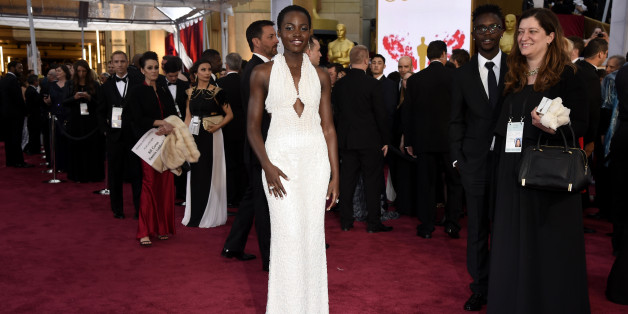 Lupita Nyong'o arrives at the Oscars on Sunday, Feb. 22, 2015, at the Dolby Theatre in Los Angeles. (Photo by Chris Pizzello/Invision/AP)