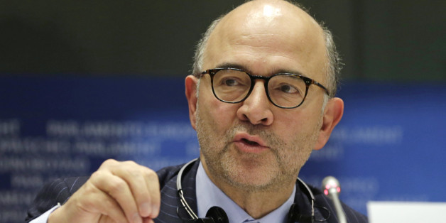 European Commissioner for Economic and Financial Affairs Pierre Moscovici addresses the Committee on Economic and Monetary Affairs on the draft budgetary plans of euro area member states, at the European Parliament building, in Brussels on Tuesday, Dec. 2, 2014. (AP Photo/Yves Logghe)