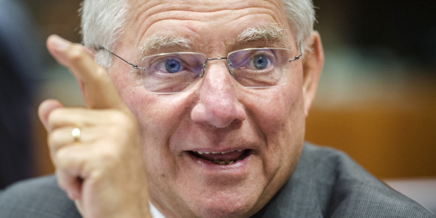 German Finance Minister Wolfgang Schauble smiles as he arrives for a EU finance ministers meeting at the European Council building in Brussels, Tuesday, July 8, 2014. (AP Photo/Geert Vanden Wijngaert)
