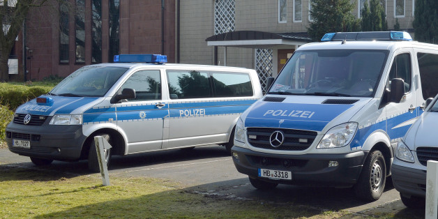 Police cars stand in front of the synagogue in Bremen, Germany, Saturday Feb. 28, 2015. Police in the German city of Bremen are warning of a potential danger from Islamic extremists there and say they are stepping up security measures. A police statement said that officials received tips about activities of potentially dangerous Islamic extremists from a German federal authority on Friday evening. Saturday's statement said that police in the northwestern city are responding "with coordinated and adapted security measures." (AP Photo/dpa, Carmen Jaspersen)