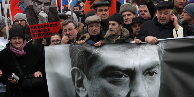 MOSCOW, RUSSIA - MARCH 01: People march in memory of Russian opposition leader and former Deputy Prime Minister Boris Nemtsov on March 01, 2015 in central Moscow, Russia. Nemtsov was murdered on Bolshoi Moskvoretsky bridge near St. Basil cathedral just few steps from the Kremlin on February 27. Nemtsov, a fierce critic of President Vladimir Putin, was shot dead ahead of a major opposition rally this weekend. (Photo by Sasha Mordovets/Getty Images)
