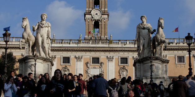 Pedestrians stroll in front of the Capitolium in Rome, Italy, on Monday, March 15, 2010. Italy's economy shrank more than originally estimated in the fourth quarter as manufacturers cut output and investments slumped in the wake of the worst recession since World War II. Photographer: Alessandra Benedetti/Bloomberg via Getty Images