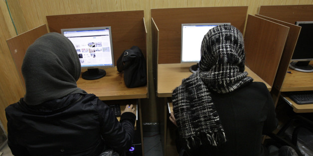 FILE- In this Monday, Feb. 13, 2012 file photo, Iranian women use computers at an Internet cafe in central Tehran. Iranâs cyber monitors often tout their efforts to fight the Westâs 'soft war' of influence through the web, but trying to ban Googleâs popular Gmail may have gone too far with complaints coming even from email-starved parliament members. (AP Photo/Vahid Salemi, File)