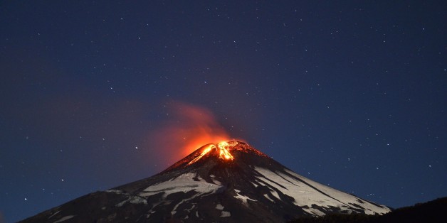 Picture of the Villarrica volcano, located near Villarrica 1200 km from Santiago, in southern Chile, which began erupting on March 3, 2015 forcing the evacuation of some 3,000 people in nearby villages. The Villarrica volcano, one of Chile's most active, began erupting around 3:00 am (0600 GMT), prompting authorities to declare a red alert and cancel classes in schools, the National Emergency Office said. AFP PHOTO /ARIEL MARINKOVIC (Photo credit should read ARIEL MARINKOVIC/AFP/Getty I