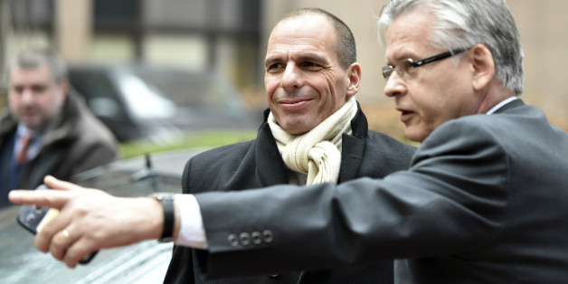 Greek Finance Minister Yanis Varoufakis, center, arrives for a meeting of eurogroup finance ministers in Brussels on Friday, Feb. 20, 2015. Eurozone finance ministers meet for a crucial day of talks Friday to see whether a Greek debt relief proposal is acceptable to Germany and other nations using the common currency. (AP Photo/Geert Vanden Wijngaert)