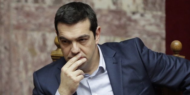Greece's Prime Minister Alexis Tsipras gestures during a Presidential vote in Athens, on Wednesday, Feb. 18, 2015. Greece's parliament elected a conservative law professor and veteran politician Wednesday as the country's new president, after he received support from the new left-wing government and main center-right opposition party. (AP Photo/Petros Giannakouris)