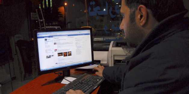 A Syrian man connects on his Facebook account at an internet cafe, in Damascus, Syria, on Tuesday Feb. 8, 2011. A media watchdog said Tuesday that Syria appears to be lifting a three-year-old ban on YouTube and Facebook, a decision that could be seen as a gesture to stave off unrest following popular uprisings in Egypt and Tunisia. The Syrian government does not comment on its Internet restrictions. But several Internet users in Syria told The Associated Press on Tuesday that the sites were acc