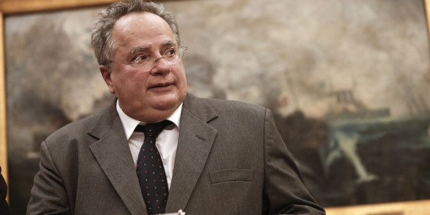 Greece's New Foreign Minister Nikos Kotzias arrives at his new office during a handover ceremony in Athens, Tuesday, Jan. 27, 2015. Greece's new left-wing Prime Minister Alexis Tsipras picked the outspoken bailout critic as his new finance minister Tuesday, signaling his revolve to take a tough line with eurozone lenders in an effort to write off a massive chunk rescue debt. (AP Photo/Petros Giannakouris)