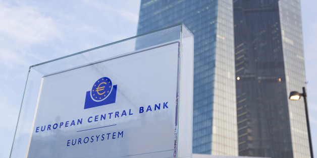 A sign sits outside the new headquarters of the European Central Bank (ECB) in Frankfurt, Germany, on Friday, Feb. 13, 2015. The ECB's plan to buy at least 1.1 trillion euros of bonds to boost inflation across the currency union is shielding the bloc's other debtor nations during the latest phase of the Greek crisis. Photographer: Martin Leissl/Bloomberg via Getty Images