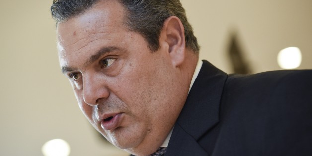 Greek Defense Minister Panos Kammenos talks to an AFP journalist at the European Union Headquarters in Brussels on February 4, 2015. Greek new Prime Minister Alexis Tsipras made Panos Kammenos defence minister in return for leading his nationalist Independent Greeks (ANEL) party into a coalition government with Syriza. AFP PHOTO / JOHN THYS (Photo credit should read JOHN THYS/AFP/Getty Images)