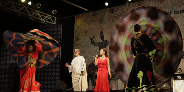 In this Friday, Feb. 6, 2015 photo, Egyptian singer Amer Eltony, in white robe, Moroccan singer Karen Ruimy and artists of Egyptian Mawlawiyahh group perform during Sufi Sutra, an international festival of Sufi and traditional music, in Kolkata, India. Besides Indian states of Rajasthan, Gujarat and West Bengal, international participants from Brazil, Denmark, Egypt, Morocco, Tunisia and Spain are also present in this three-day event. (AP Photo/Bikas Das)