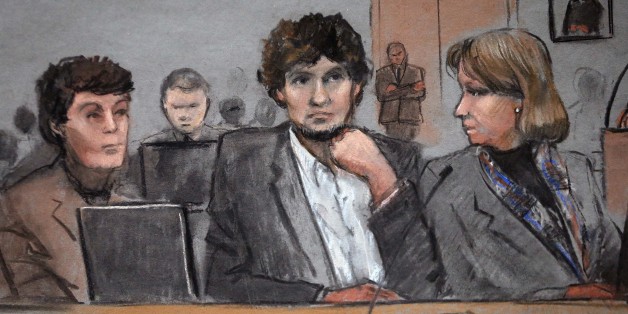 In this courtroom sketch, Dzhokhar Tsarnaev, center, is depicted between defense attorneys Miriam Conrad, left, and Judy Clarke, right, during his federal death penalty trial, Thursday, March 5, 2015, in Boston. Tsarnaev is charged with conspiring with his brother to place two bombs near the Boston Marathon finish line in April 2013, killing three and injuring 260 people. (AP Photo/Jane Flavell Collins)