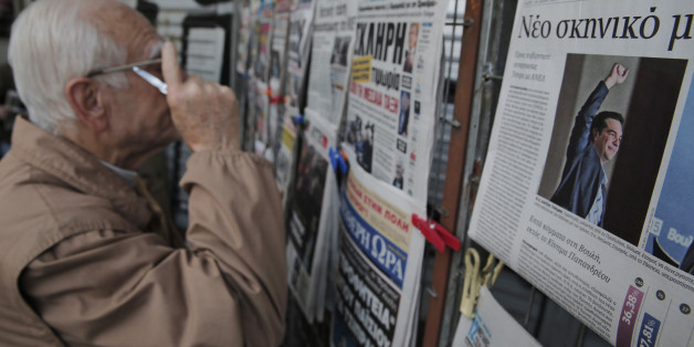 An Athenian reads newspapers featuring front page stories and photos of Alexis Tsipras, leader of Greece's Syriza left-wing main opposition party's win on Sunday's national elections, on a kiosk in central Athens, in Athens, Monday, Jan. 26, 2015. Greece's Syriza party gained the key backing needed to form a government Monday, creating a surprise alliance with the Independend Greeks, a small right-wing party that signals possible confrontation over the country's bailout. Although the alliance between two ideologically opposed parties who share only their opposition to the bailout was a surprise, it nevertheless boosted stock markets across Europe that had fallen on news of the uncertain election results and fear of a second election. (AP Photo/Lefteris Pitarakis)
