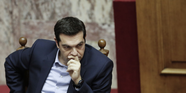 Greece's Prime Minister Alexis Tsipras attends a parliament session in Athens, on Tuesday, March 10, 2015. Tsipras spoke during a special debate on whether to revive a parliamentary committee that would seek German World War II reparations that Greece says were never fully paid. The committee would also seek the return of a forced loan raised by Nazi occupation forces, and of Greek antiquities removed during the war. (AP Photo/Petros Giannakouris)