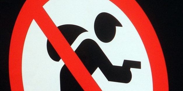 A clever way of preventing crime: ban theft and robbery! But the big-bereted (or is it big-nosed) villain does not look too afraid.