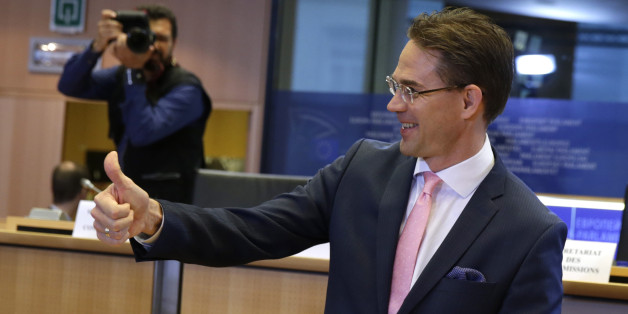 European Union Commissioner designate for Jobs, Growth, Investment and Competitiveness Jyrki Katainen shows a thumb up ahead of a hearing at the Committee on Economic and Monetary Affairs, the Committee on Employment and Social Affairs, the Committee on Industry, Research and Energy and the Committee on Transport and Tourism and the Committee on Regional Development, at the European Parliament in Brussels, on Tuesday, Oct. 7, 2014. (AP Photo/Yves Logghe)