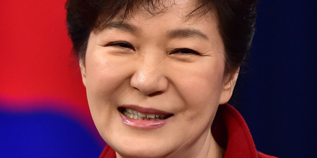 South Korean President Park Geun-hye smiles during her New Year's press conference at the presidential Blue House in Seoul Monday, Jan. 12, 2015. (AP Photo/Jung Yeon-je, Pool)