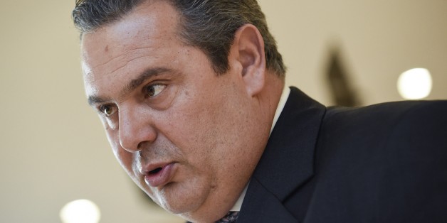 Greek Defense Minister Panos Kammenos talks to an AFP journalist at the European Union Headquarters in Brussels on February 4, 2015. Greek new Prime Minister Alexis Tsipras made Panos Kammenos defence minister in return for leading his nationalist Independent Greeks (ANEL) party into a coalition government with Syriza. AFP PHOTO / JOHN THYS (Photo credit should read JOHN THYS/AFP/Getty Images)