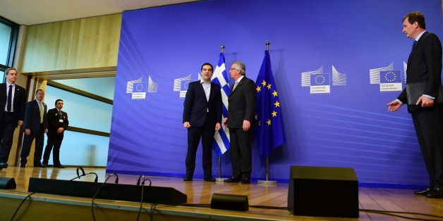 Greece's Prime Minister Alexis Tsipras (L) is welcome by European Commission President Jean-Claude Juncker at the European Commission in Brussels on March 13, 2015. Tsipras is in Brussels for talks on Athens' debt-hit bailout. AFP PHOTO/Emmanuel Dunand (Photo credit should read EMMANUEL DUNAND/AFP/Getty Images)