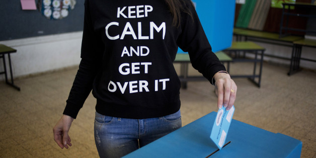 Israeli woman Rachel Yankovich Roe, casts her vote inside a polling station, in Netanya, Israel, Tuesday, March 17, 2015. Israelis are voting in early parliament elections following a campaign focused on economic issues such as the high cost of living, rather than fears of a nuclear Iran or the Israeli-Arab conflict. (AP Photo/Ariel Schalit)