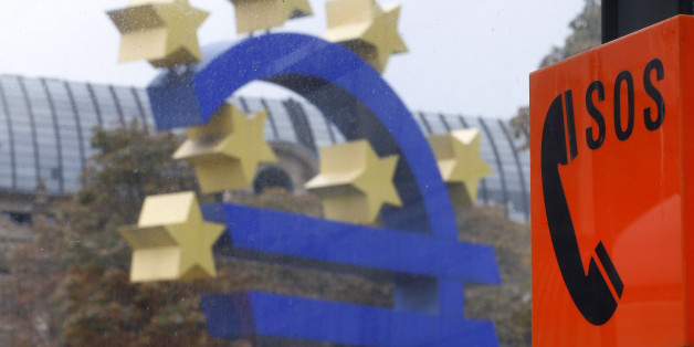 An emergency phone at a tram stop stands next to the Euro sculpture in Frankfurt, Germany, Sunday, Oct. 26, 2014. The European Central Bank, ECB, nnounced the results of a stress test that simulated how the finances of banks would fare in an economic downturn in Frankfurt, Germany, Sunday, Oct. 26, 2014. (AP Photo/Michael Probst)