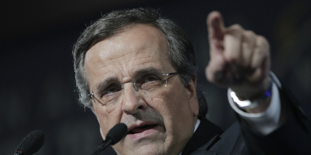 Greece's Prime Minister Antonis Samaras delivers his final campaign speech at the Taekwondo Indoor Stadium in southern Athens on Friday, Jan. 23, 2015. All opinion polls on Sunday's closely-watched national election agree: The radical left opposition Syriza party, which has vowed to rewrite the terms of Greece's international bailout, enjoys a lead of at least 4 percentage points over Prime Minister Antonis Samaras' conservatives. (AP Photo/Lefteris Pitarakis)