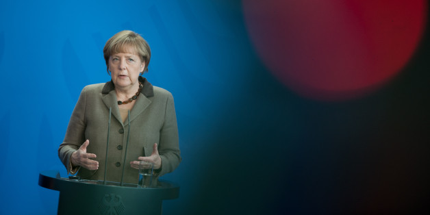 German Chancellor Angela Merkel attends a news conference after a meeting with Romanian President Klaus Iohannis at the chancellery in Berlin, Germany, Thursday, Feb. 26, 2015. (AP Photo/Steffi Loos)