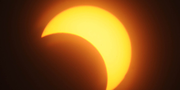 KHARTOUM, SUDAN - NOVEMBER 3: A partial solar eclipse is seen over the Sudanese capital Khartoum on November 3, 2013. A rare solar eclipse sweeps parts of North America, Europe and Africa, allowing a view of the Sun totally or partially blocked out by the Moon. (Photo by Stringer/Anadolu Agency/Getty Images)