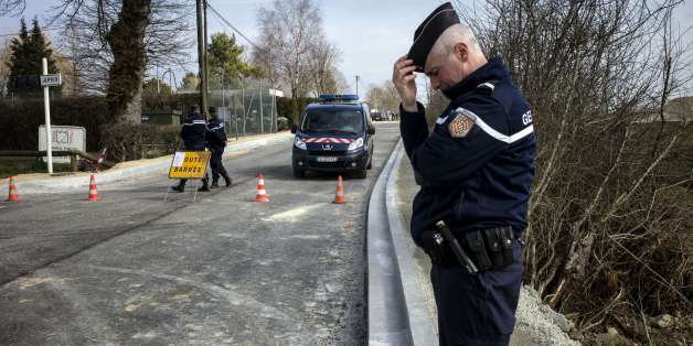 A French gendarme stands as the road is close in Avallon on March 11, 2015 after a group of 'battle-hardened' armed thieves attacked two heavily guarded vans carrying jewels at the Avallon French motorway toll in the dead of night, making off with a haul worth some nine million euros ($11 million), police said. The vans were found burnt and abandoned in a field not far from the toll station, and it was as yet unclear exactly how the assault unfolded.
AFP PHOTO / JEFF PACHOUD (Photo credit should read JEFF PACHOUD/AFP/Getty Images)