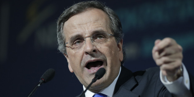 Greece's Prime Minister Antonis Samaras delivers his final campaign speech at the Taekwondo Indoor Stadium in southern Athens on Friday, Jan. 23, 2015. All opinion polls on Sunday's closely-watched national election agree: The radical left opposition Syriza party, which has vowed to rewrite the terms of Greece's international bailout, enjoys a lead of at least 4 percentage points over Prime Minister Antonis Samaras' conservatives. (AP Photo/Lefteris Pitarakis)