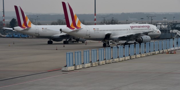 Two planes of German airline German Wings park at the airfield on Cologne/Bonn airport on March 24, 2015 in Cologne, western Germany . The head of low-budget airline Germanwings said there were 144 passengers and six crew on the Airbus A320 that crashed in the French Alps en route to Duesseldorf from Barcelona. AFP PHOTO / PATRIK STOLLARZ (Photo credit should read PATRIK STOLLARZ/AFP/Getty Images)