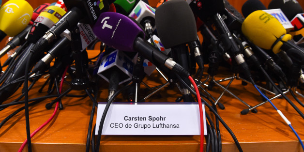 BARCELONA, SPAIN - MARCH 25: A signal with the name of Lufthansa Group CEO Carsten Spohr sits among media microphones ahead of a press conference at the Terminal 2 of the Barcelona El Prat Airport on March 25, 2015 in Barcelona, Spain. All 144 passengers and six members of flight crew of the Germanwings flight, which is believed to have included 45 Spanish and 67 German nationals, are believed to have been killed after the aircraft rapidly lost height and fell into a remote area of the southern
