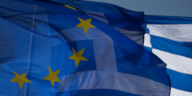 ATHENS, GREECE - JANUARY 23: The national flag of Greece and the flag of the European Union fly above a government building ahead of the general election on Sunday on January 23, 2015 in Athens, Greece. According to the latest opinion polls, the left-wing Syriza party are poised to defeat Prime Minister Antonis Samaras' conservative New Democracy party in the election, which will take place on Sunday. European leaders fear that Greece could abandon the Euro, write off some of its national debt