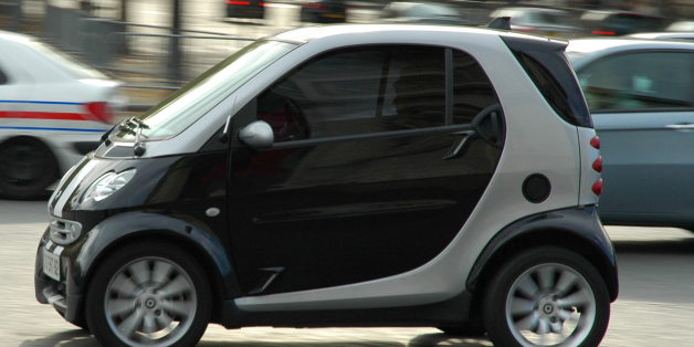 These "Smart Cars" ( <a href="http://en.wikipedia.org/wiki/Smart_(automobile)">en.wikipedia.org/wiki/Smart_(automobile)</a> ) are all over the place in Europe.
Here is one driving around l'Arc de Triumph.